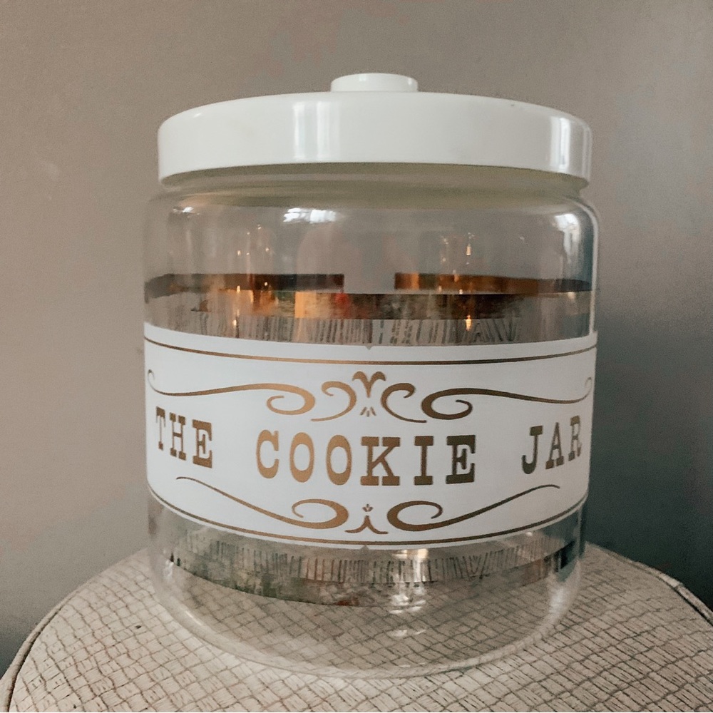 Vintage Pyrex “The Cookie Jar” glass canister with cream plastic lid.